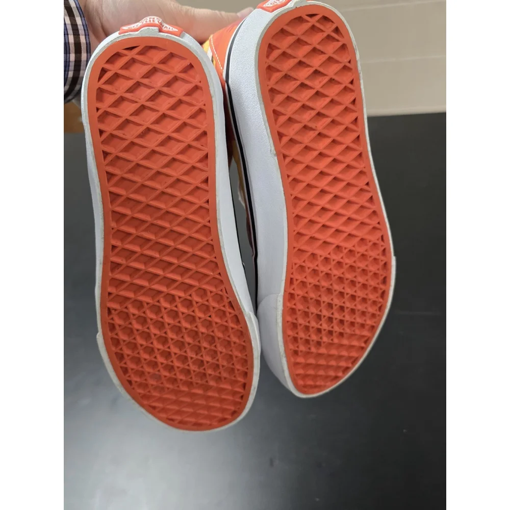 Vans Sk8-Hi high-top sneakers in an orange and yellow camouflage